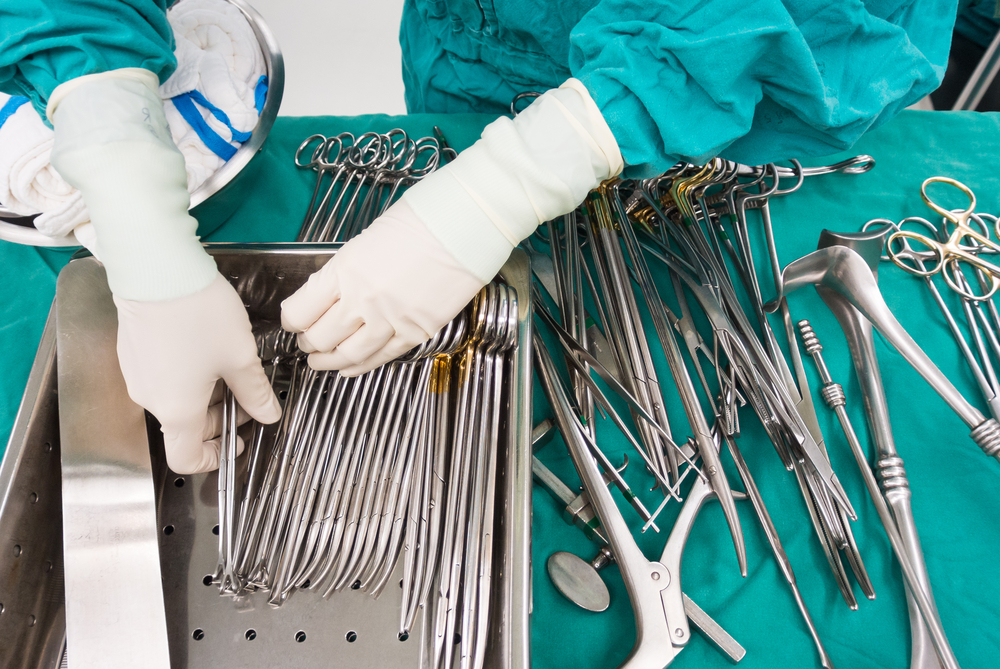Surgeon using a scalpel alongside AI-assisted surgery tools.